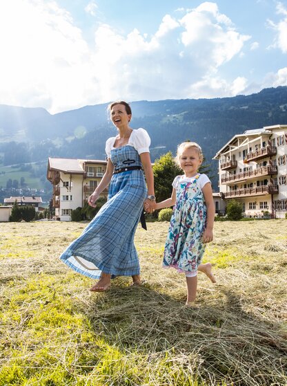 Mother and child enjoy springtime in the hay at the Hotel Theresa