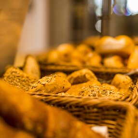 A bread basket sits on a table during breakfast at Hotel Theresa Zillertal