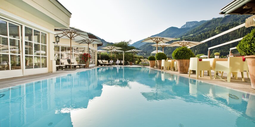 The outdoor pool at Hotel Theresa Zillertal is used in the summer