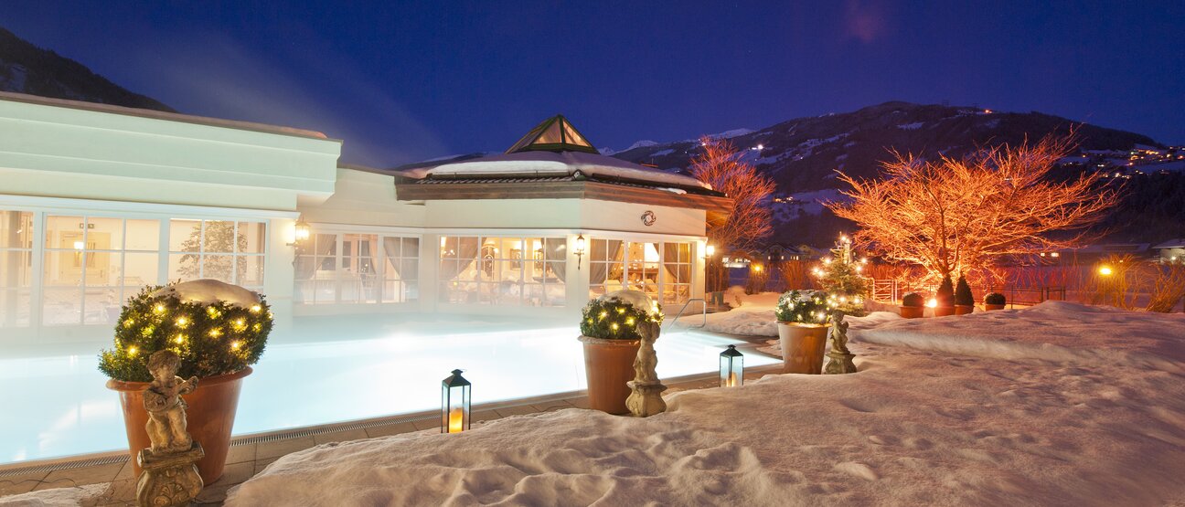 The winter pool at Hotel Theresa in the Zillertal is atmospherically lit