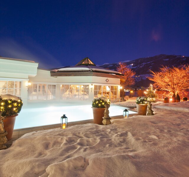 The winter pool at Hotel Theresa in the Zillertal is atmospherically lit