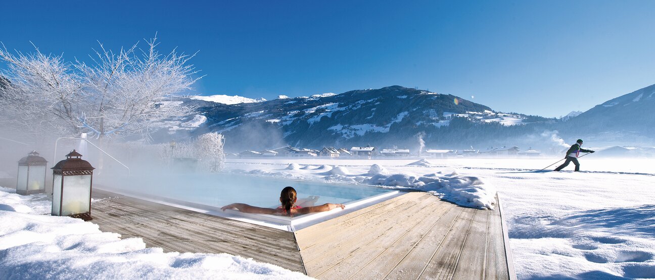 Cross-country skier passes the brine pool of Hotel Theresa in Zillertal