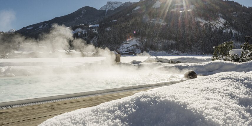 Steam rises above the brine pool of Hotel Theresa in Zillertal in winter